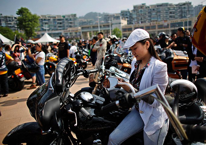 Harley rally: A woman sits on a Harley Davidson motorcycle during the annual Harley David