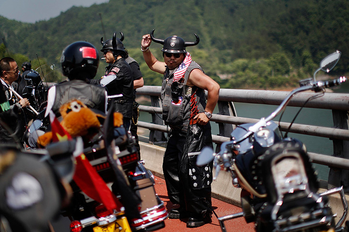 Harley rally: A rider dances as he takes a break during the rally 