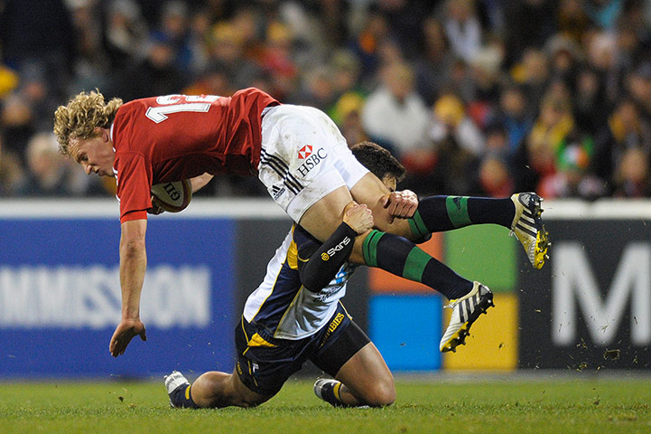 Lions: Billy Twelvetrees is felled by Matt Toomua