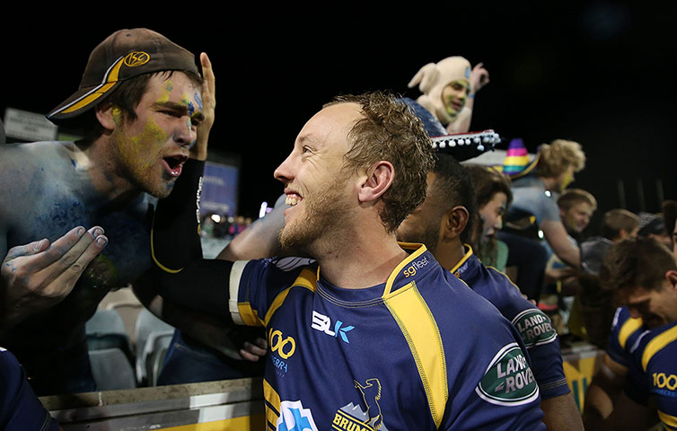 Lions: Jesse Mogg of the Brumbies celebrates with fans