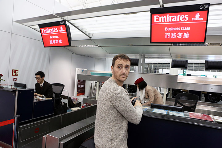 Atherton: Atherton checking in his luggage at Hong Kong 