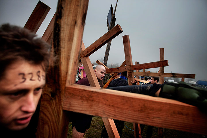 Tough Guy - Weekend: Tough Guy race. Men who carry a wooden cross are allowed to start earlier.