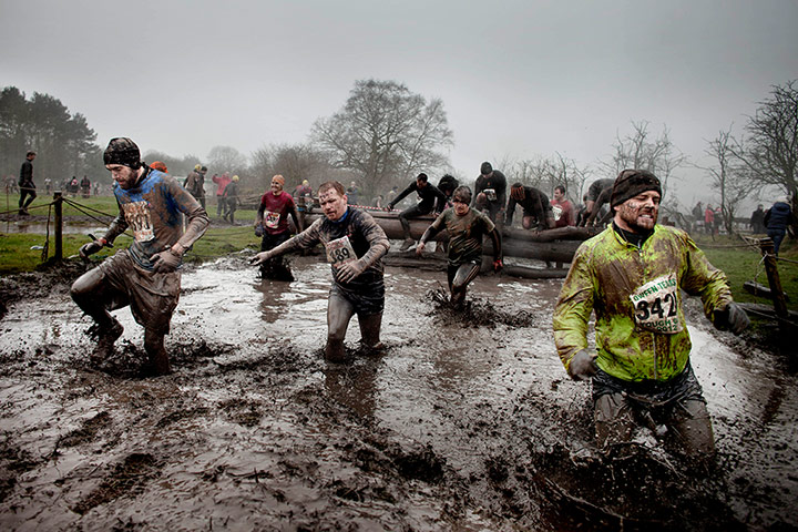 Tough Guy - Weekend: Men run through muddy canal 