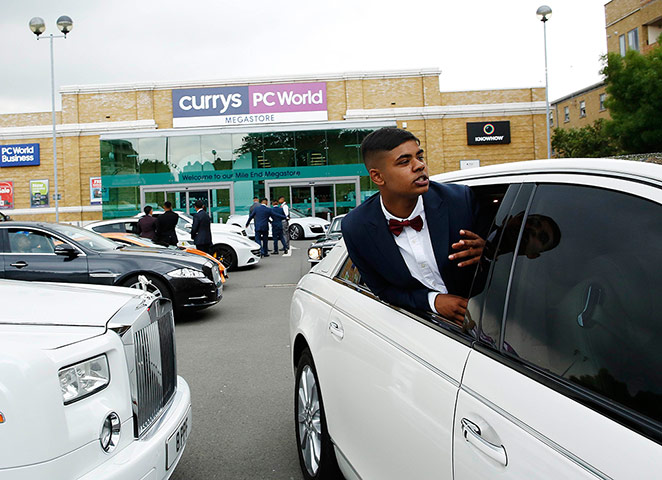 Supercar parade: Samad Ahmed, 16, leans out of a Maybach