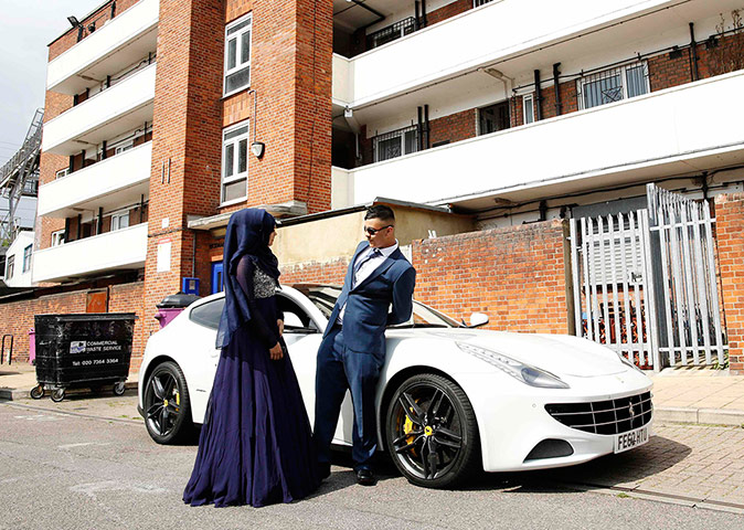 Supercar parade: Aisha, 16, talks to fellow pupil Tanvir Shahriyar, 16, next to his hired Fe
