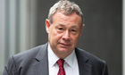 Banker contests £450,000 fine for allegedly disclosing inside information