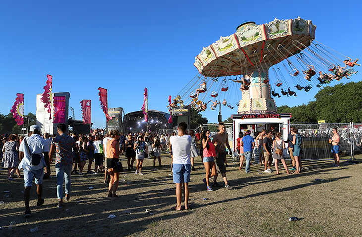 Lovebox: Festival goers ride the swings as Rudimental perform on the main stage on d