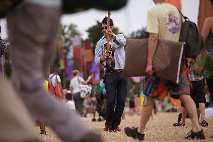 Womad weekend: Musician Joseph Arthur plays in a field