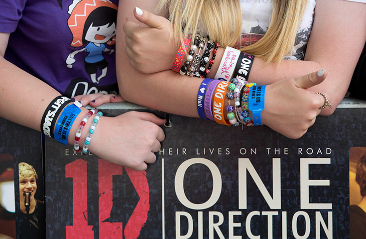 One Direction fans: Fans wearing armbands 