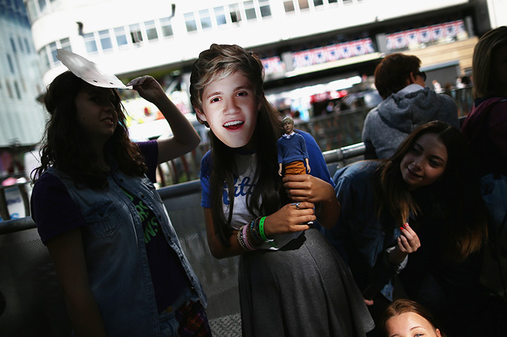 One Direction fans: Fans pose with masks
