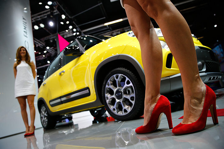 Frankfurt motor show 2013: Models pose beside a Fiat 500L Trekking