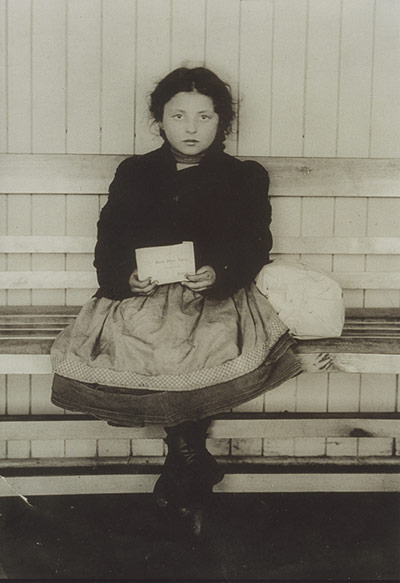 red star line: Girl with Red Star Line ticket for America