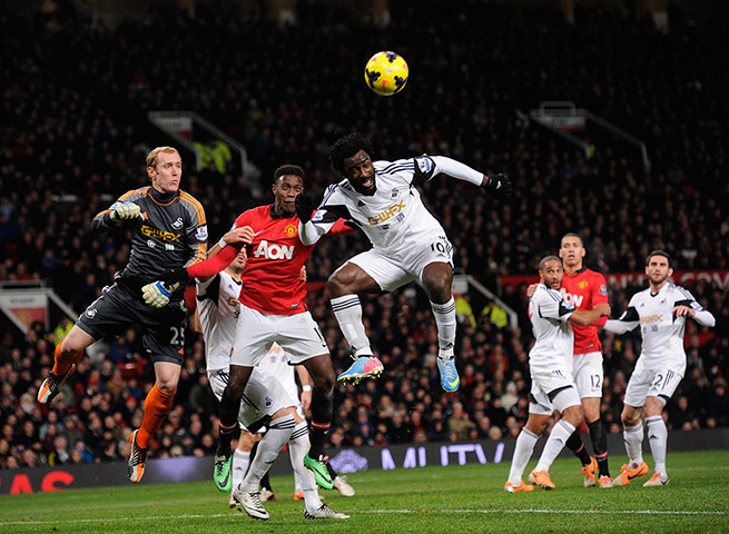 United versus Swansea: Danny Welbeck goes for a header