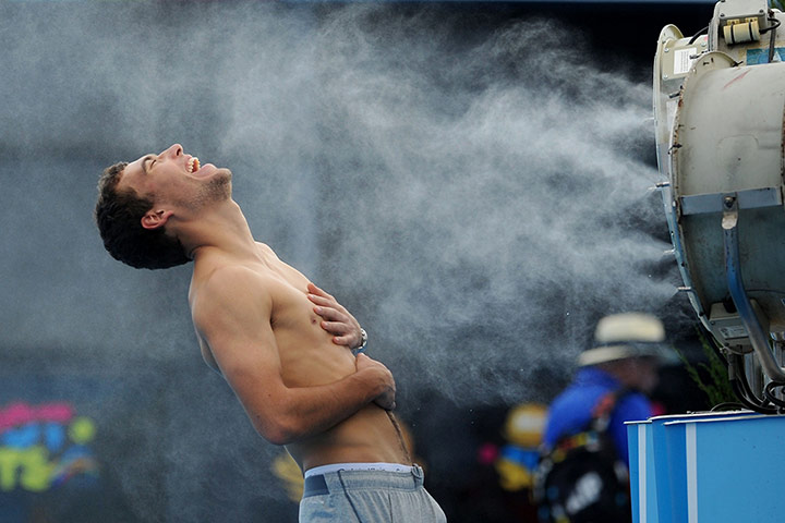 20 Photos: Jerzy Janowicz of Poland here cools off in front of the fans