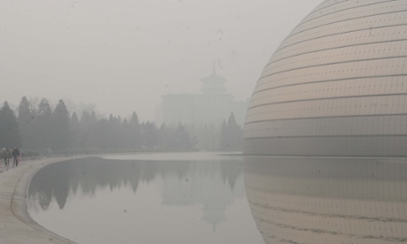 The National Grand Theatre, one of Beijing's landmarks, is blanketed in heavy smog in January 2014.