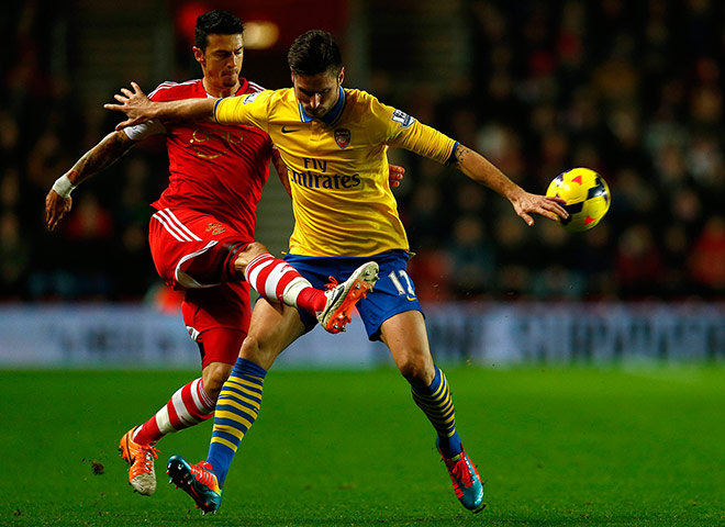 Tuesday's games: Southampton's Fonte challenges for the ball with Arsenal's Giroud 