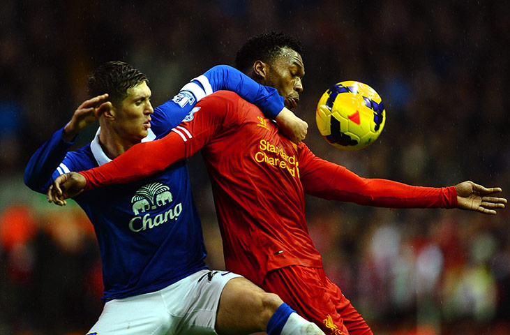 Tuesday's matches: Daniel Sturridge attempts to control the ball despite John Stones