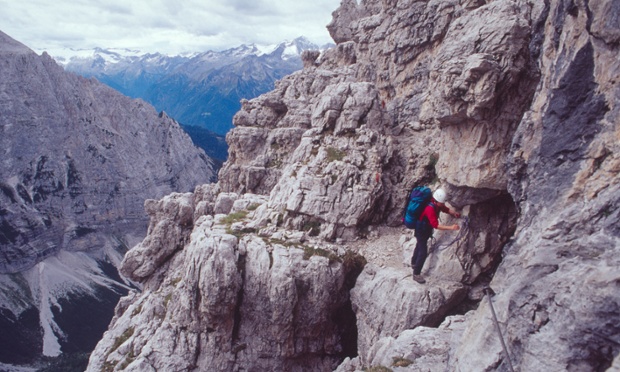 Although the Via Ferrata in the Dolomites can be hiked safely and are a popular attraction, you will still nead a head for height and a steady foot to handle traversing the many sheer cliff edges. This climber is tackling the via ferrata on the Brenta Dolomites.