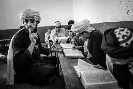 Young boys attend their Quran study sessions at the Islami Noor religious school in Kandahar