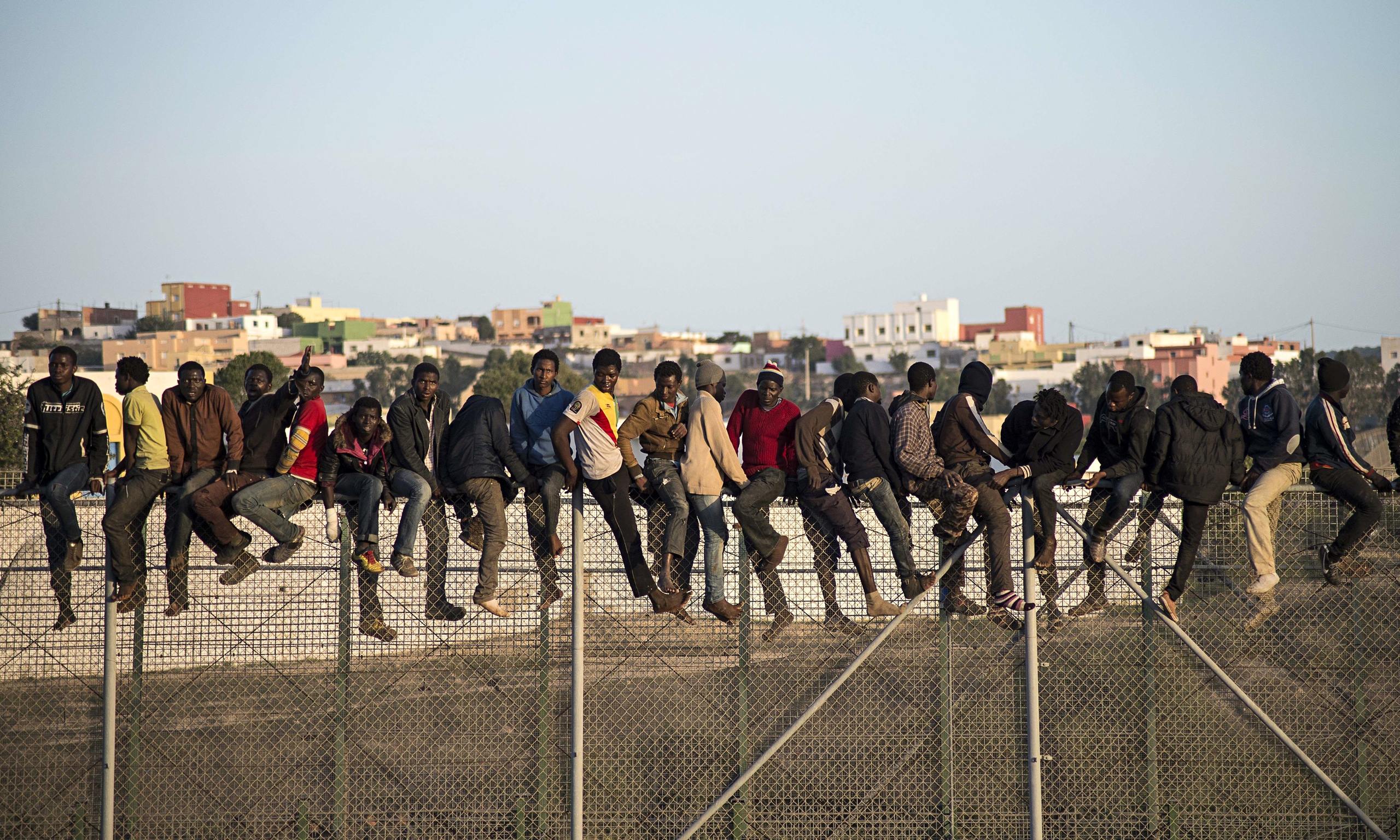 nine-injured-as-migrants-rush-spanish-border-fence-in-north-africa