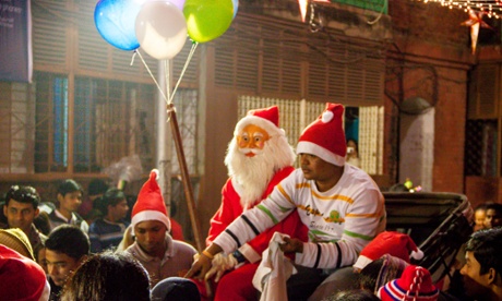 Santa comes to Bow Barracks on a hand-pulled rickshaw.