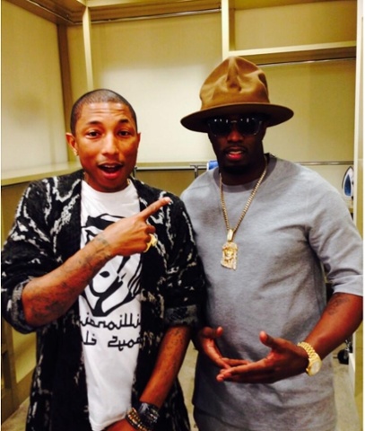 Pharrell Williams and P Diddy wearing a hat that has it's own Twitter account.