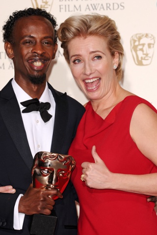 Barkhad Abdi who won the award for Best Supporting Actor for the film 'Captain Phillips' with presenter Emma Thompson