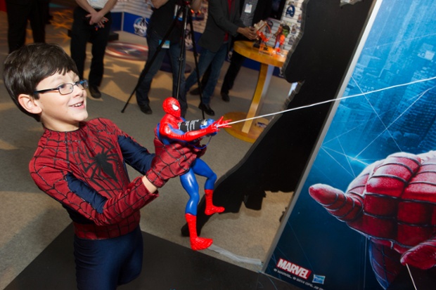 Child actor with Spider-Man toy