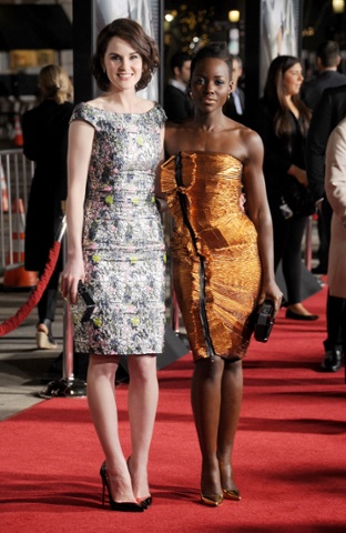 WESTWOOD, CA - FEBRUARY 24: Actors Michelle Dockery and Lupita Nyong'o arrive at the Los Angeles premiere of 