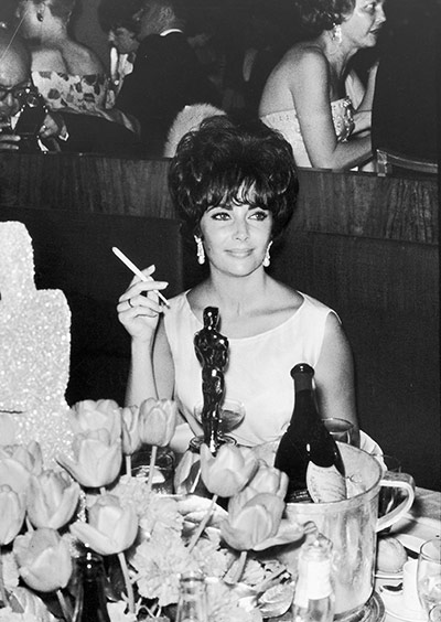 LIFE at the Oscars: Elizabeth Taylor at a party after winning Best Actress for Butterfield 8 in