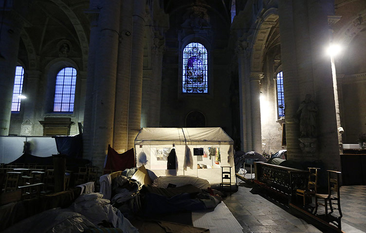 20 Photos: Afghan asylum seekers camp inside a Catholic church in Brussels