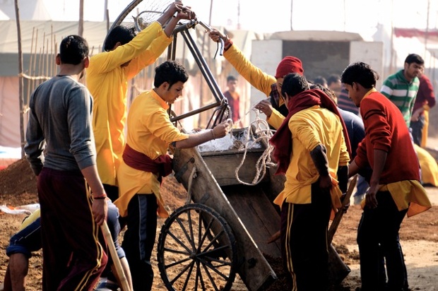 workers exchanging tools and materials