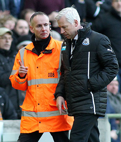 Pardew Headbutt: Pardew is escorted by a stern looking steward 