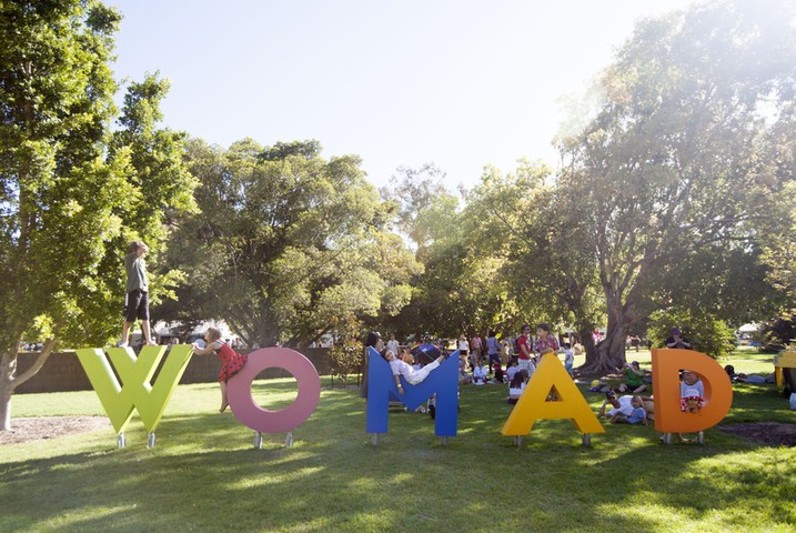 WOMADelaide festival: Children play on the WOMAD sign on Saturday evening