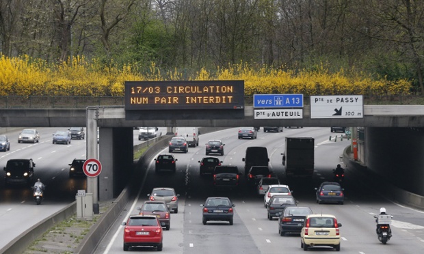 Cars drive under a road sign reading'' 17/03 from 5h30 traffic for even numbers forbidden'' on the Parisian ring road, on March 17, 2014 as Paris resorted to drastic measures to curb soaring pollution levels by forcing all cars with number plates ending in even numbers off the road for the first time in two decades. Around 700 police officers were deployed to man 60 checkpoints around the French capital to ensure that only cars with number plates ending in odd numbers were out on the streets.
