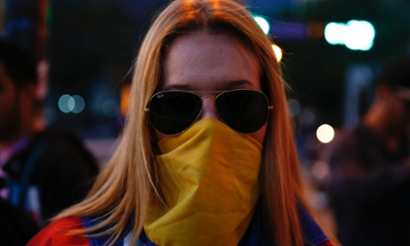 A Venezuelan protester poses for a portrait at Altamira square in Caracas., From ImagesAttr