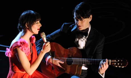 Karen O and Ezra Koenig perform onstage during the Oscars