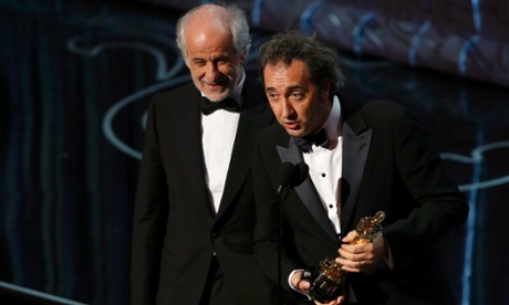 Director Paolo Sorrentino actor and Tony Servillo accept the Oscar for best foreign language film