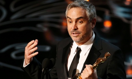Alfonso Cuarón with his Oscar for best director