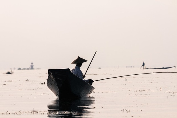 Navigating Inle Lake: 'Peaceful navigation on Inle Lake, Myanmar'.