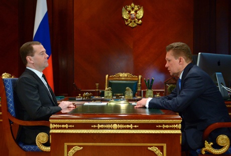 Russian Premier Dmitry Medvedev meets Russian state natural giant gas monopoly Gazprom head Alexei Miller, right, at the Gorky residence outside Moscow on Tuesday, March 4, 2014.