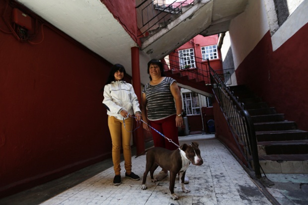 Rosaura Realsola, 51, stands with her daughter Alexandra Yamileth, 13, in front of their home in Tepito in Mexico City. Rosaura is a domestic cleaner, who finished her education at 16. She says that when she was a child, she wanted to be a teacher when she grew up. Rosaura hopes that her daughter Alexandra will become a nurse. Alexandra will finish education in 2023 and says she wants to be a nurse when she grows up.