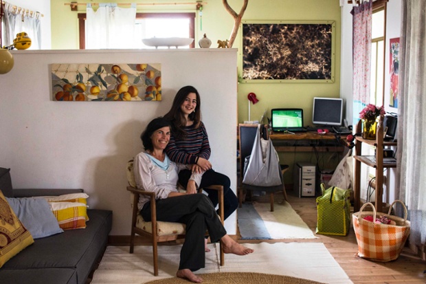 Vered, 43, poses for a photograph with her daughter Alma, 13, in their home in Kibbutz Hukuk near the Sea of Galilee in northern Israel. Vered got a degree in design at the age of 27 and currently runs educational art projects in local communities. Vered hopes that her daughter Alma will find a profession that brings her happiness and satisfaction. Alma will graduate high-school in five years, at the age of 18, and says she would like to be a part of the film industry as a director, camerawoman, editor or actor.