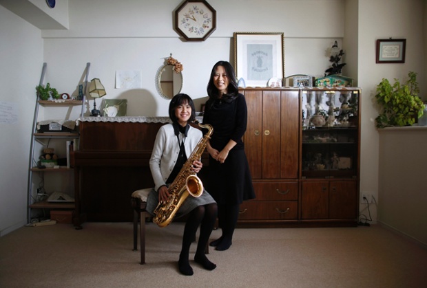 Manami Miyazak, 39, and her daughter Nanaha, 13, pose at their home in Tokyo. Manami, who is a housewife, studied until she was 20. Her ambition was to work somewhere where she could meet lots of people. She hopes that her daughter will build a loving home with a happy marriage. She says it would be great if her daughter could find work that makes use of her abilities and interests. Nanaha wants to be either a designer, musician or a nurse.