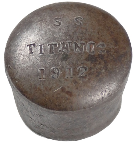 A steel rivet head, measuring 1.5 inches in diameter, taken from the Harland and Wolff shipyard by a worker after the construction of the Titanic in 1912. It was routine for yard workers to take an extra rivet for a newly-built ship as a souvenir of their hard work. This particular head was kept private for years, as the original owner felt a deep sense of shame and grief over the tragedy.