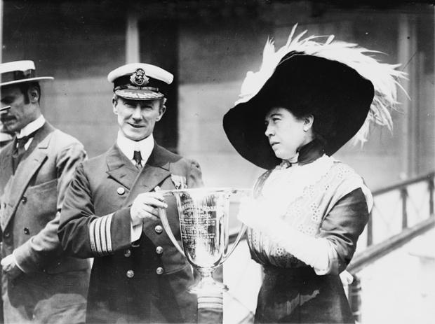 Margaret “Molly” Brown presents the Loving Cup to Captain Arthur Rostron. When the ship struck the iceberg, Brown leapt into action, loading others into lifeboats. By this time, Captian Rostron had received a distress signal and set the Carpathia on course for the Titanic. Rostron and his crew rescued over 700 passengers. Once aboard the Carpathia, Brown nursed the wounds of other passengers, and once everyone was stable, established a committee to raise money for destitute survivors, collecting $10,000 before the Carpathia even reached New York.