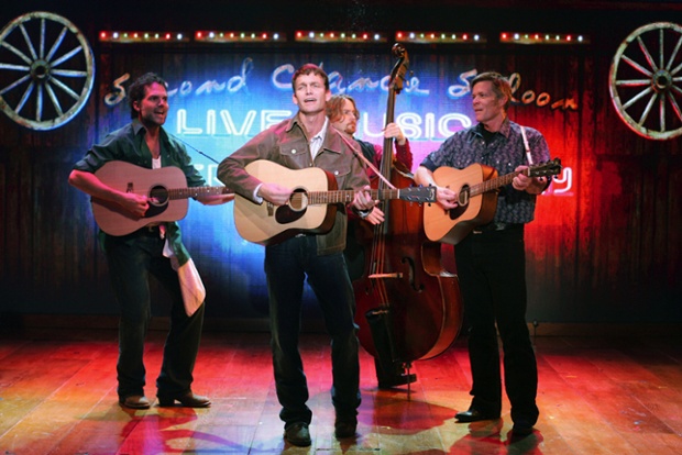 This undated photo supplied by the Studio Arena Theatre shows Jeb Brown, left, Jarrod Emick, Dan Immel, background, and Jason Edwards, right, in 