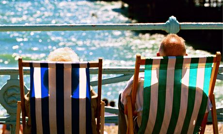 People in deckchairs, Brighton beach