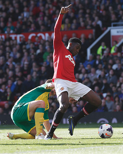 United v Norwich: Danny Welbeck is brought down by Steven Whittaker for a penalty