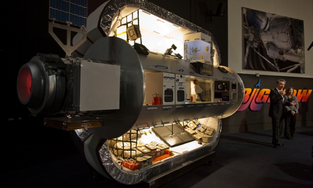 Bigelow Aerospace president Robert Bigelow, left, and Nasa deputy administrator Lori Garver. Bigelow is supplying Nasa with a Bigelow Expandable Activity Module, a habitat module for the International Space Station. Pictured here is a one third scale model of the BA 330 module, a different module similar in function to what the new Bigelow Expandable Activity Module will be.